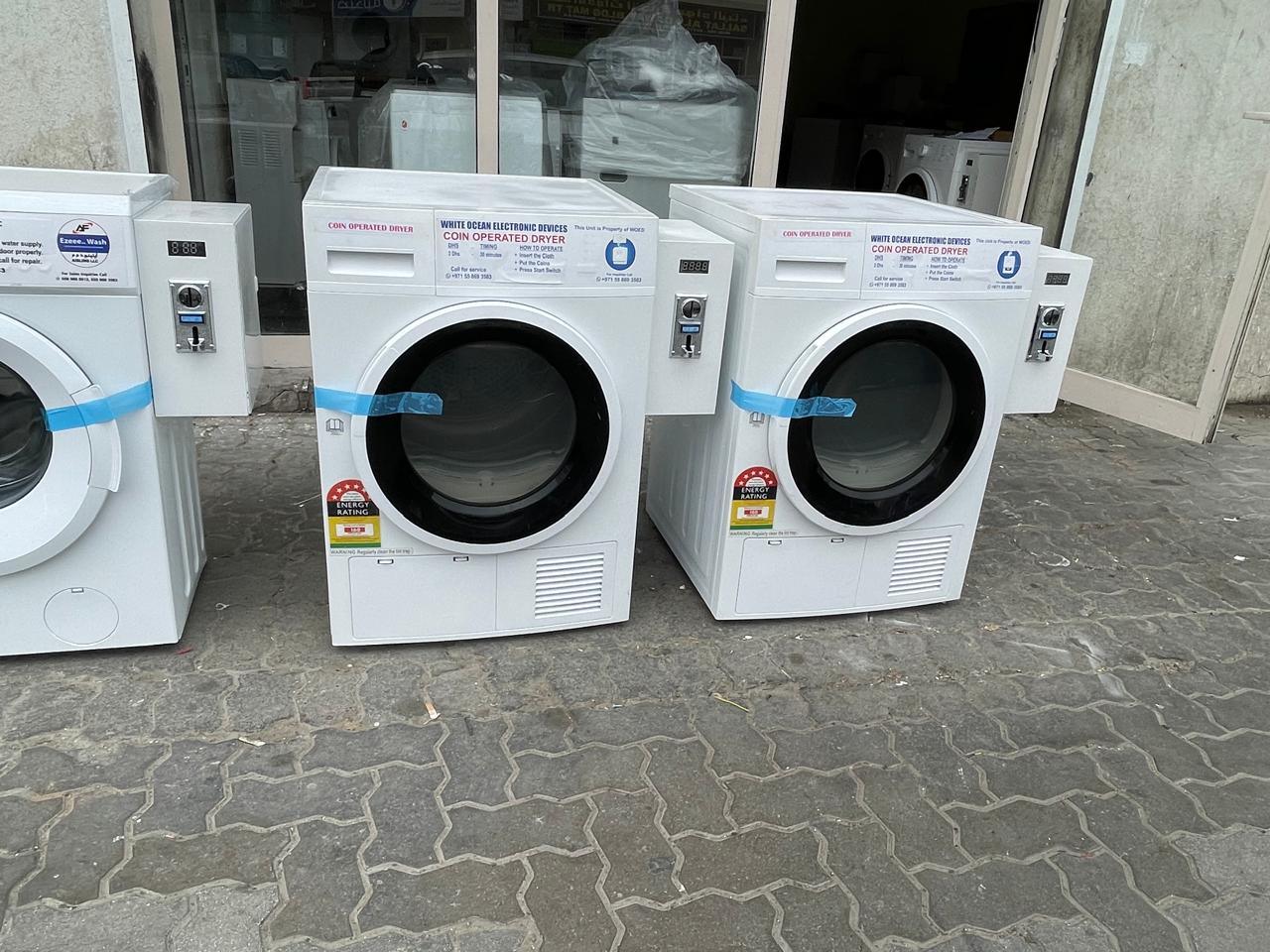 Coin laundry room UAE apartment